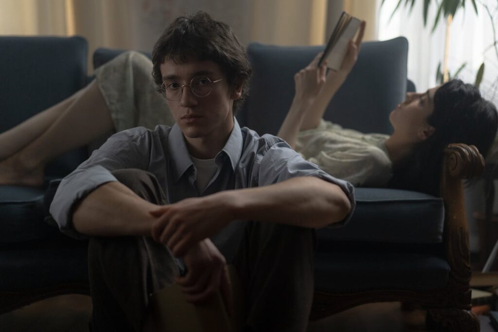 Person alone looking conflicted representing self-doubt caused by signs of covert narcissism in relationships