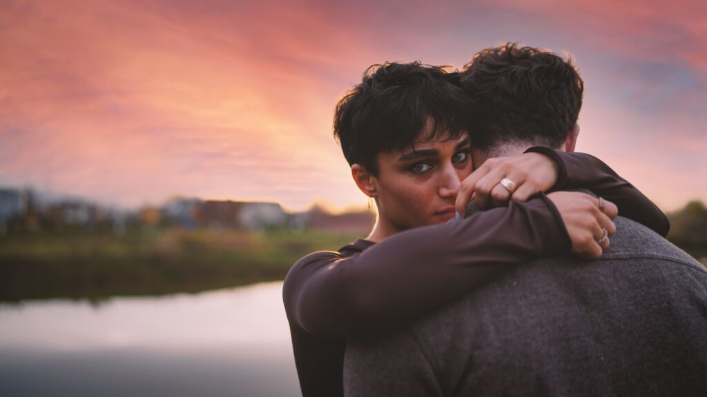 Couple embracing while exploring the difference between love and emotional attachment