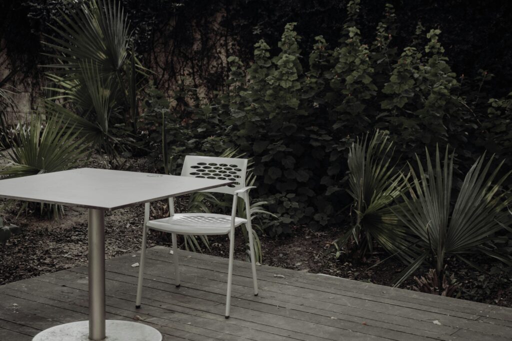 empty chair at table representing the quiet cost of losing yourself in a relationship