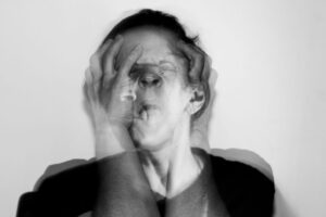 Emotionally distressed person showing signs of trauma bonding in a toxic relationship